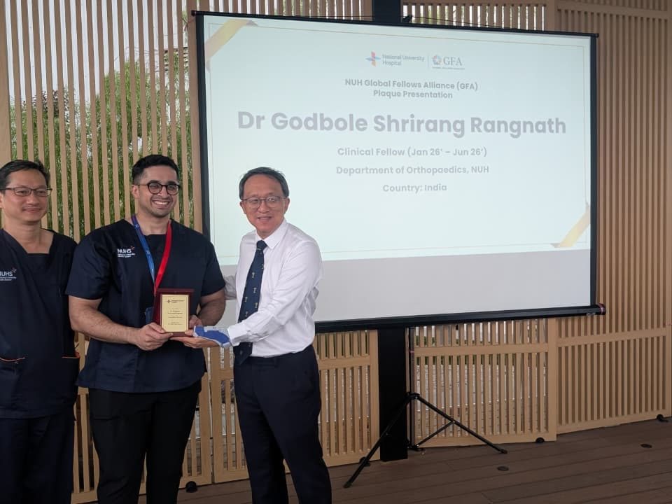Dr. Godbole's induction into the NUH Global Fellows Alliance with Dr. Mark Puhaindran and Dr. James Hui