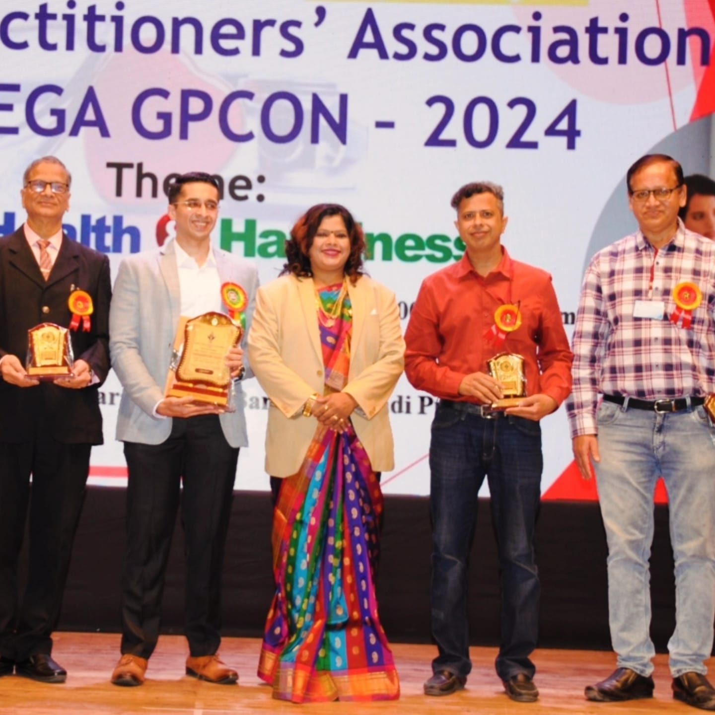 Dr. Godbole felicitated at MEGA GPCON 2024